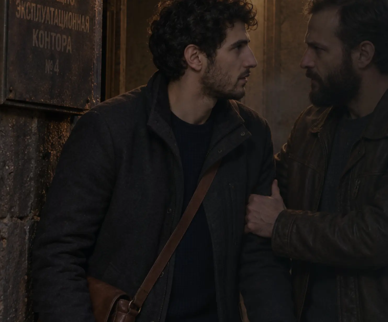 Concept art: the older Hakob grips Adam's arm in a dark Leninakan doorway